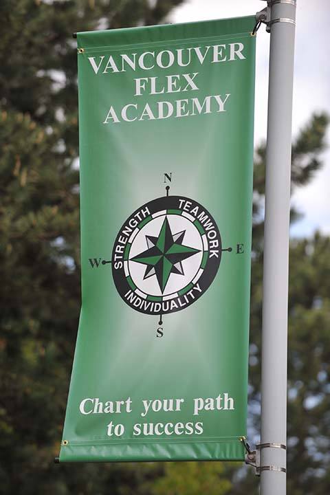 Sign outside the school that says chart your path to success