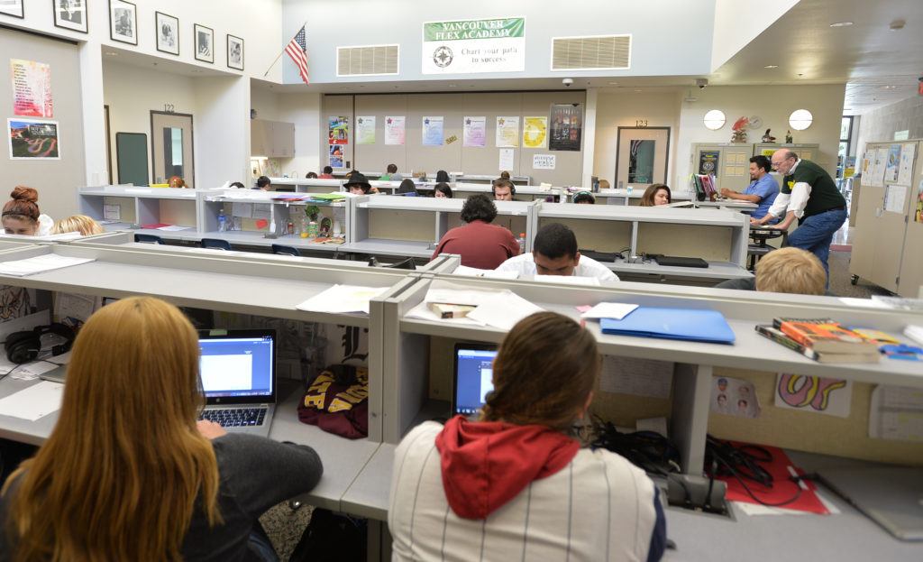 High school students Flex students working on computers in a flexible learning environment