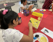 Students painting at La Plaza at Harney Elementary School